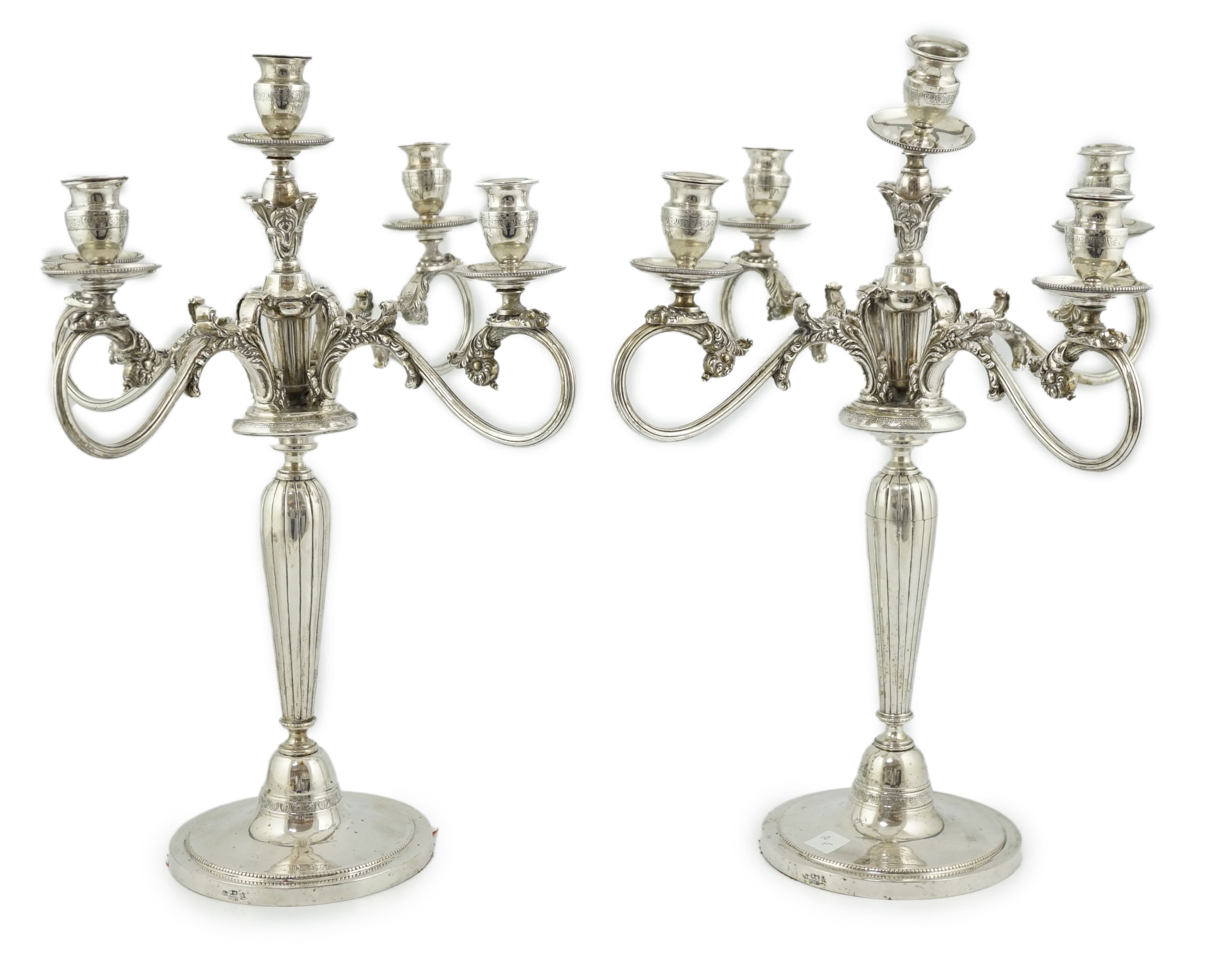 A pair of late 19th century Russian 84 zolotnik four branch, five light candelabra